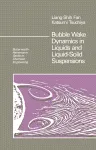 Bubble Wake Dynamics in Liquids and Liquid–Solid Suspensions